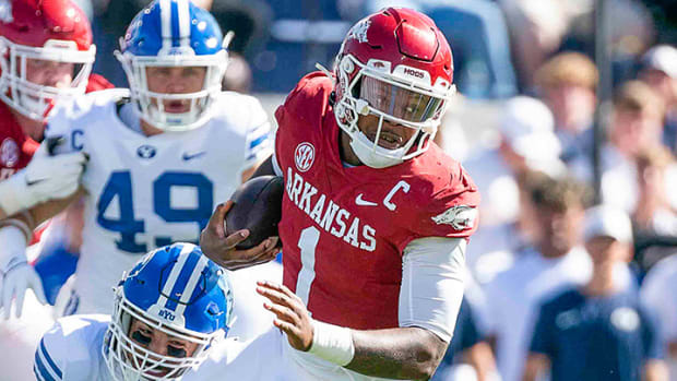 Arkansas quarterback KJ Jefferson escapes BYU defensive lineman Tyler Batty in the first quarter at LaVell Edwards Stadium.